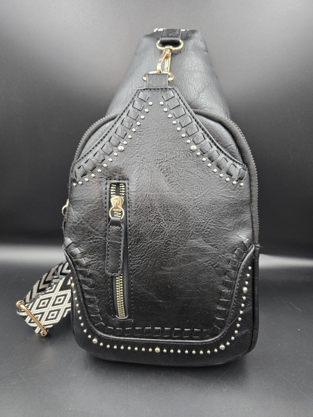 Black Studded Women's Leather Sling Backpack with Patterned Strap